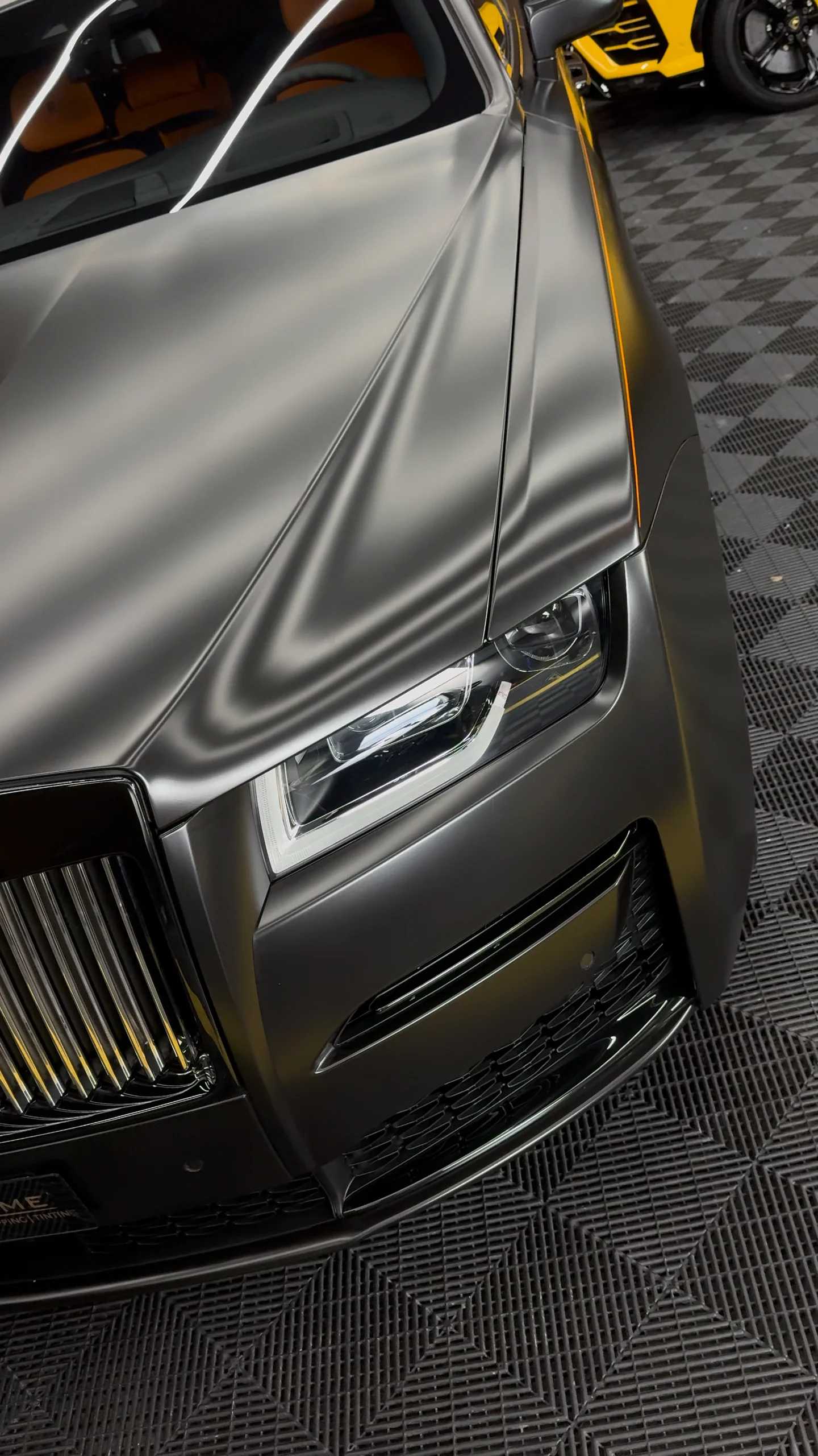 Satin grey Rolls-Royce Ghost finish detail under WrapME studio lighting