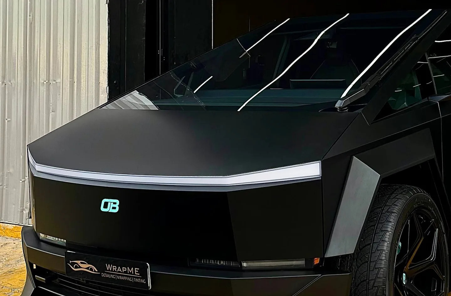 Satin-black PPF and custom bodykit project outside the WrapME workshop