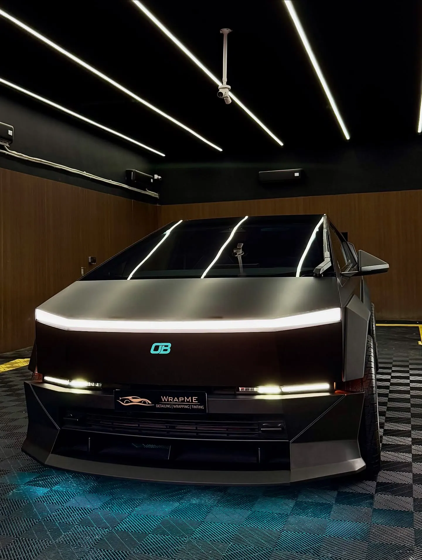 Front view of a satin-black PPF and custom bodykit project in the WrapME workshop