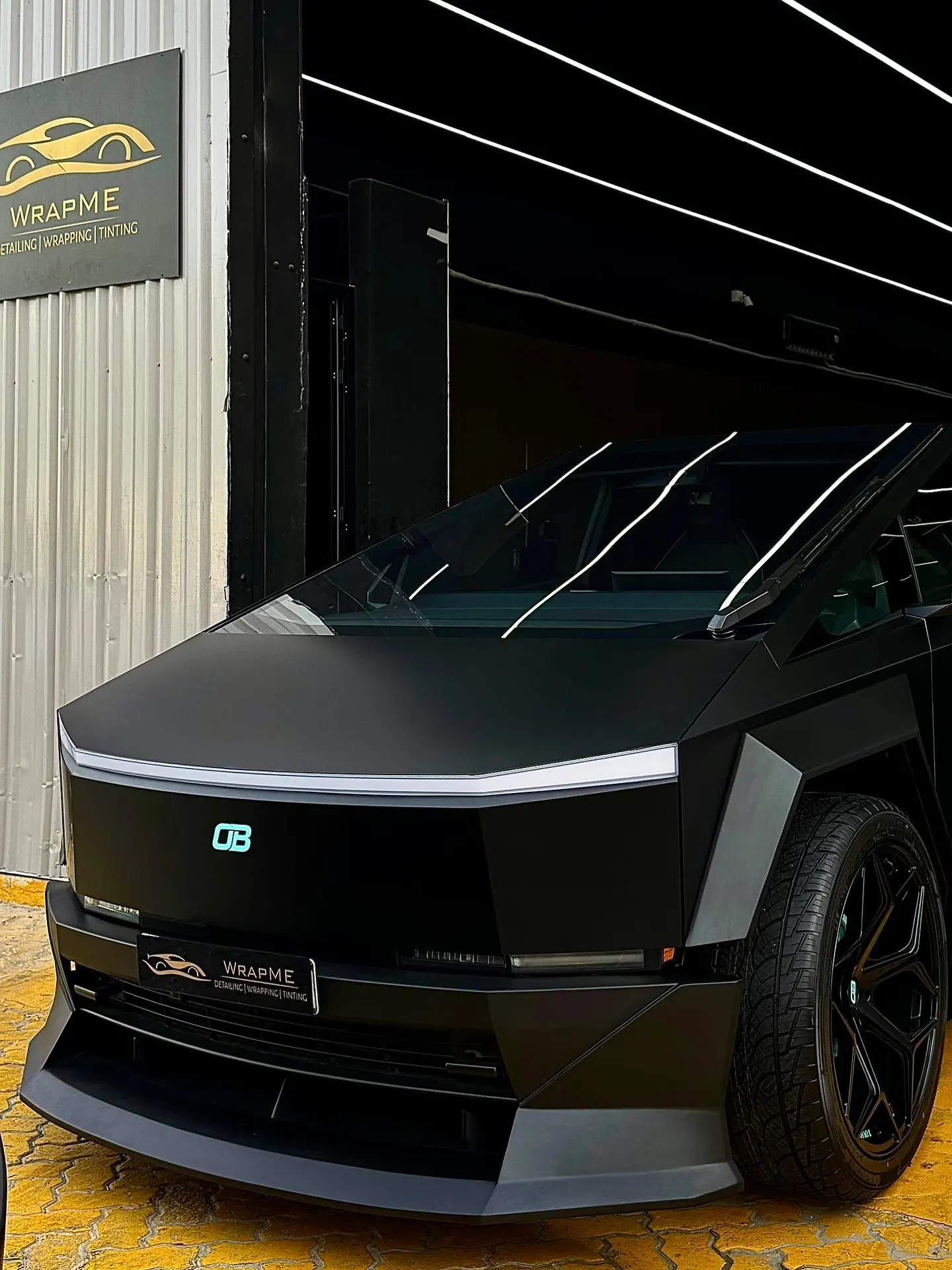 Satin-black PPF and custom bodykit project outside the WrapME workshop